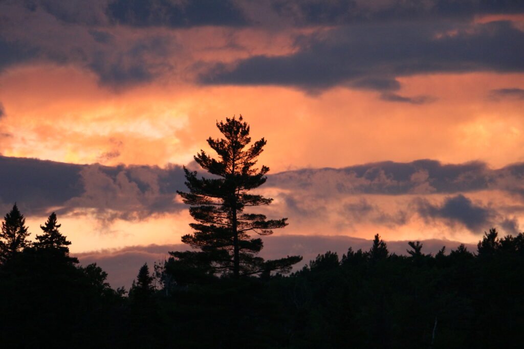Gold, orange, and purple sunset afterglow over Lake Umbagog National Wildlife Refuge