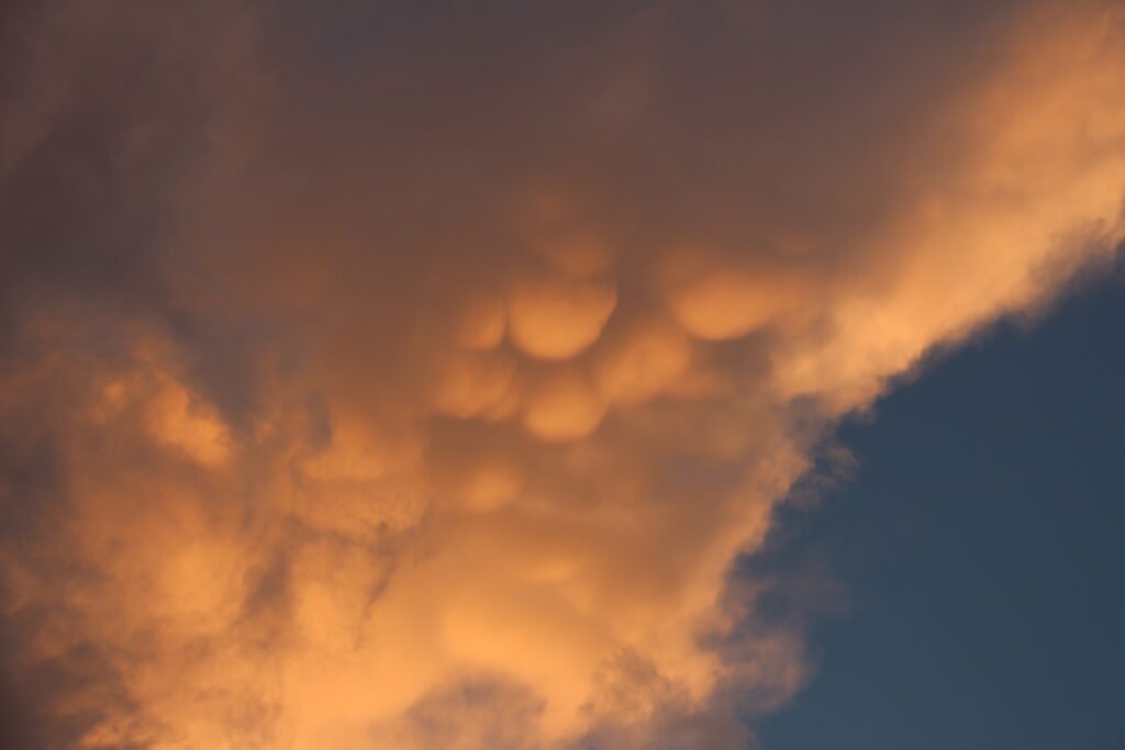 Glowing mammatus clouds over Lake Umbagog National Wildlife Refuge at sunset