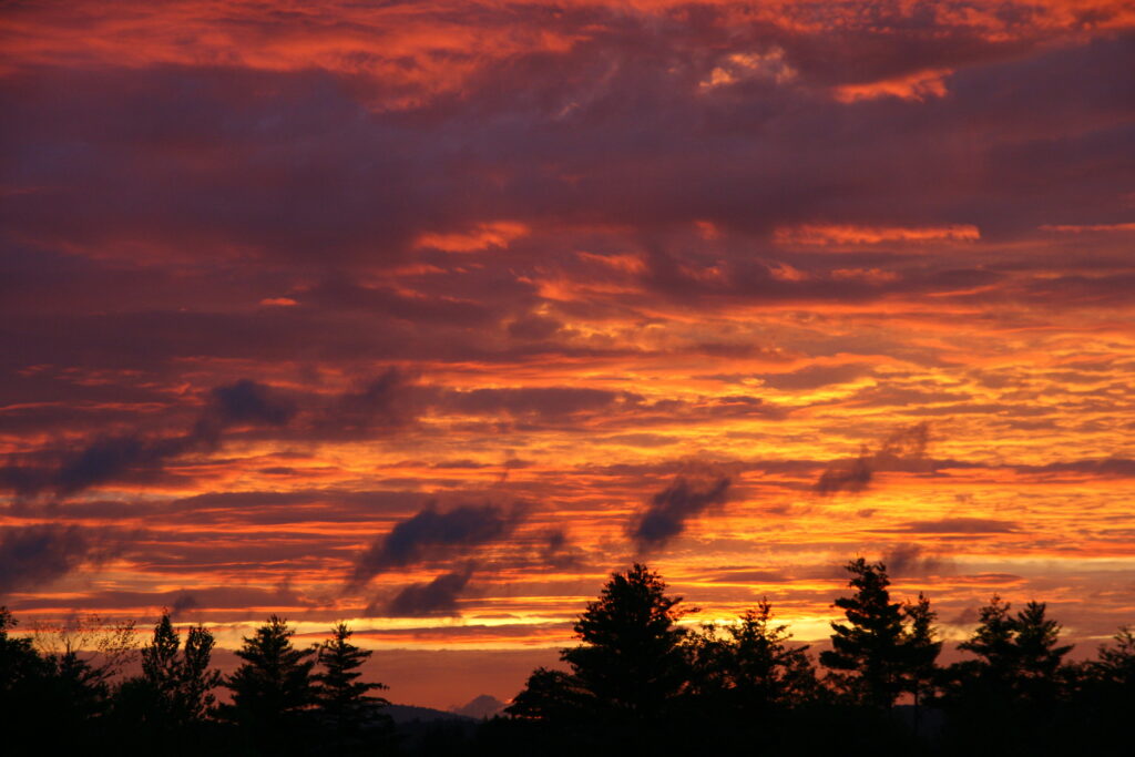 Vibrant sunset after a rainstorm over the landscape in Gorham, Maine