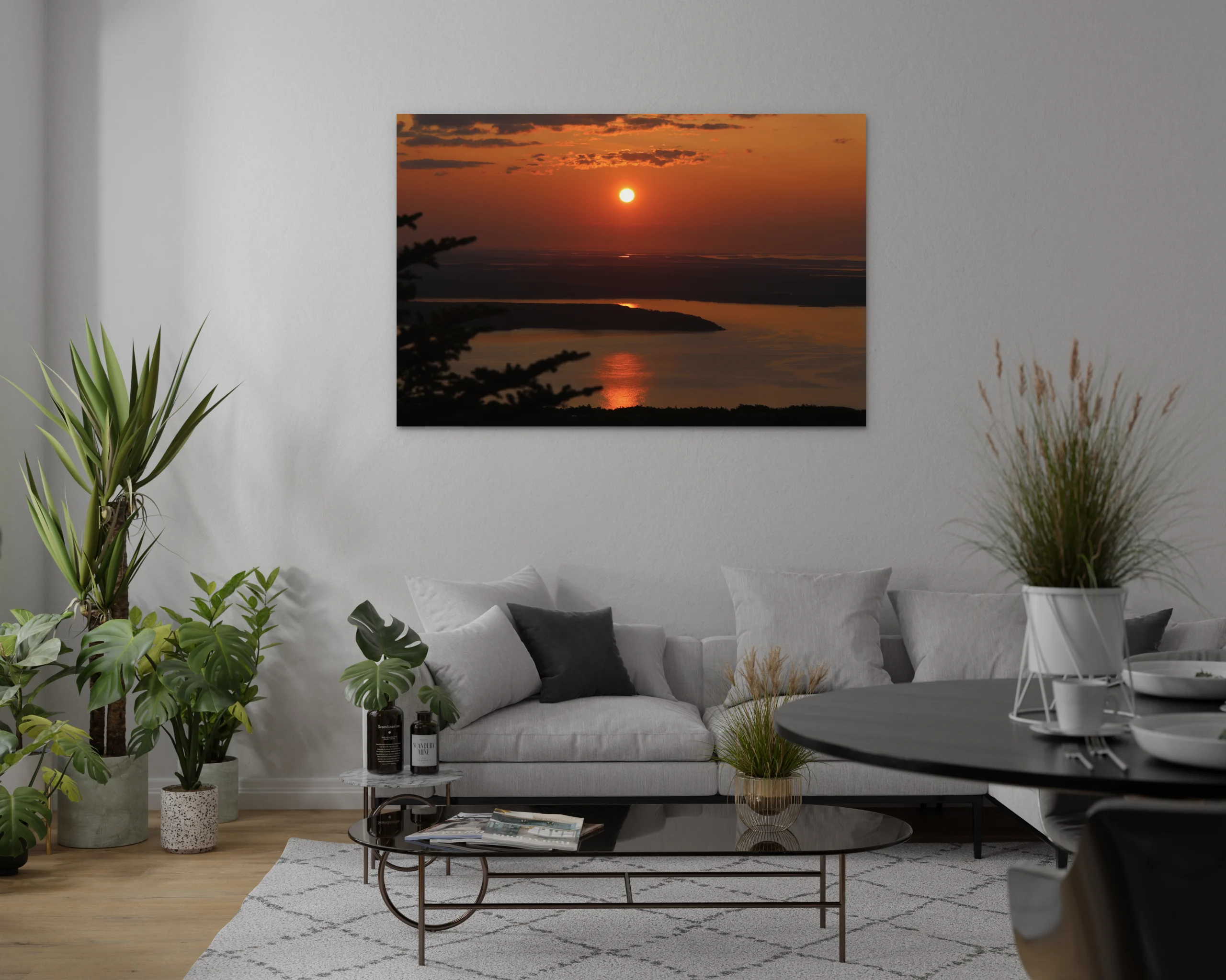 Mockup of a horizontal fine art canvas print of a golden sunrise over Cadillac Mountain in Acadia National Park, Maine, hanging on a living room wall.